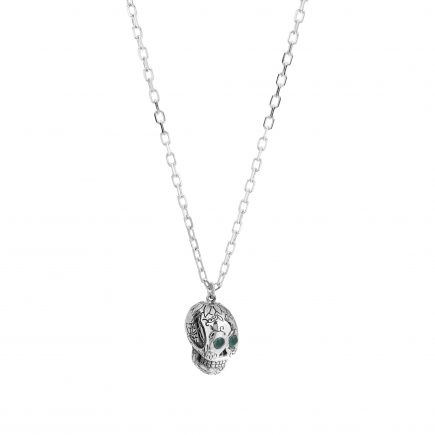 Silver sugar skull pendant set with cabachon emeralds
