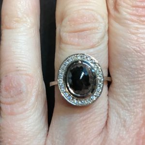 18ct white gold and black rose-cut diamond and white diamond halo ring