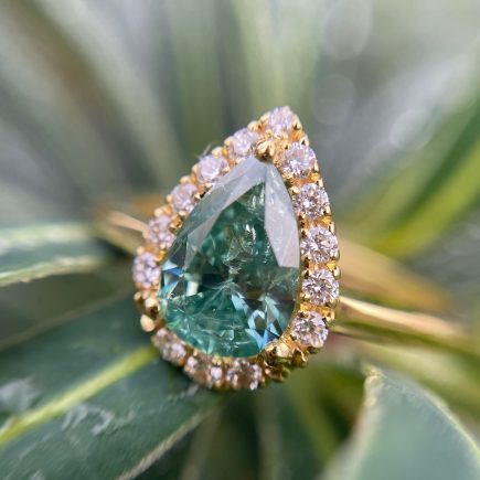 18ct yellow and pear green diamond halo engagement ring