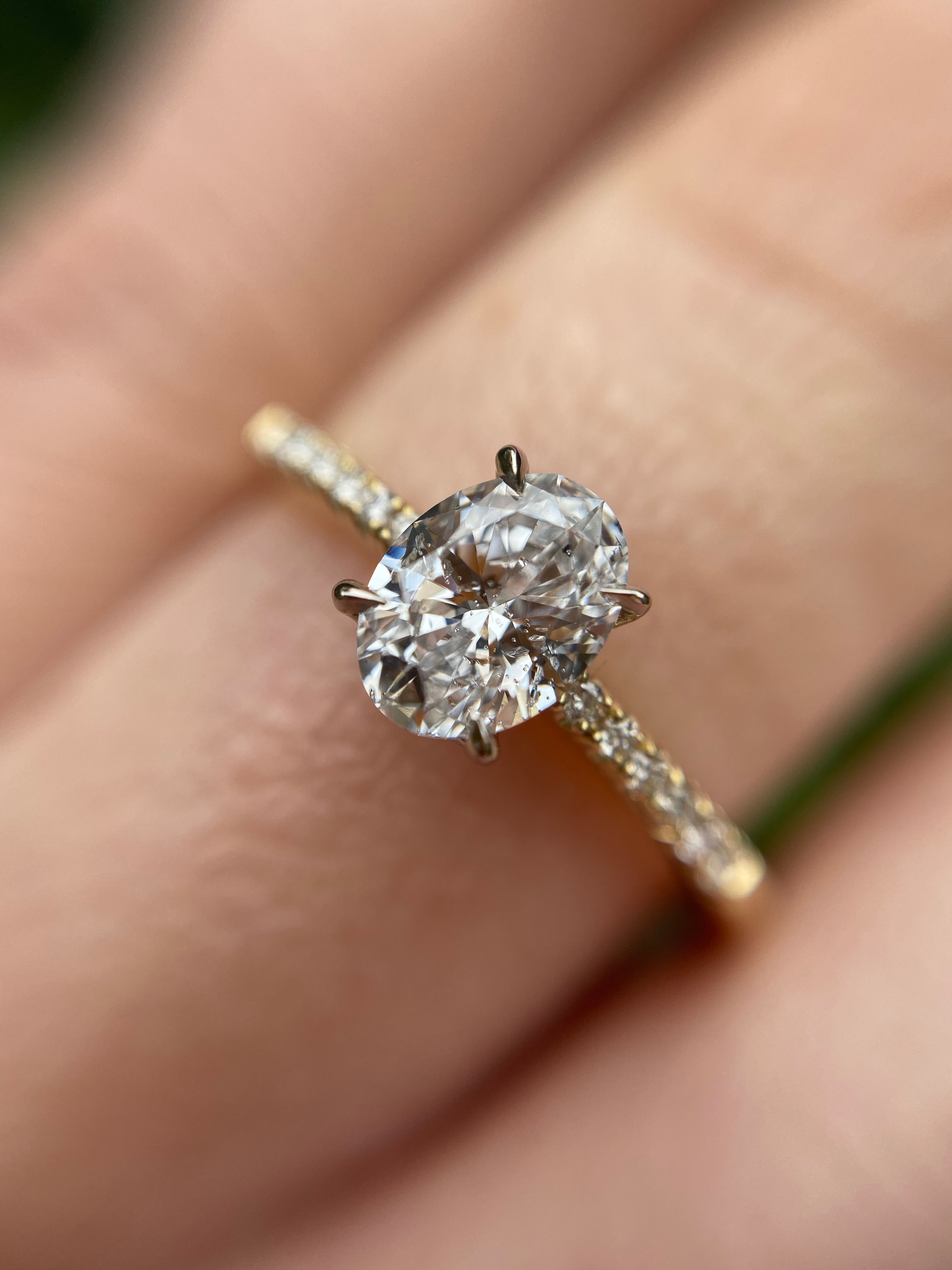 18ct yellow gold and oval white diamond engagement ring with diamond