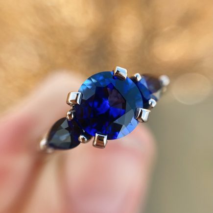 18ct white gold and fine blue sapphire trilogy ring
