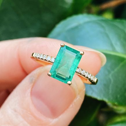18ct yellow gold and Octagon Emerald engagement ring with diamond-set shoulders