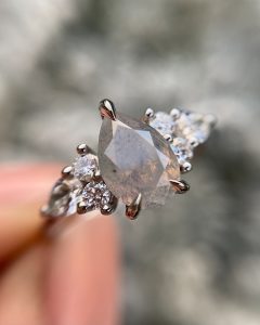 Platinum Unicorn Pear Diamond Ring with White Diamond Shoulder Detail