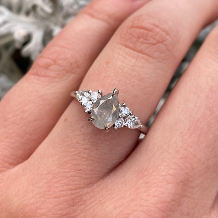 Platinum Unicorn Pear Diamond Ring with White Diamond Shoulder Detail