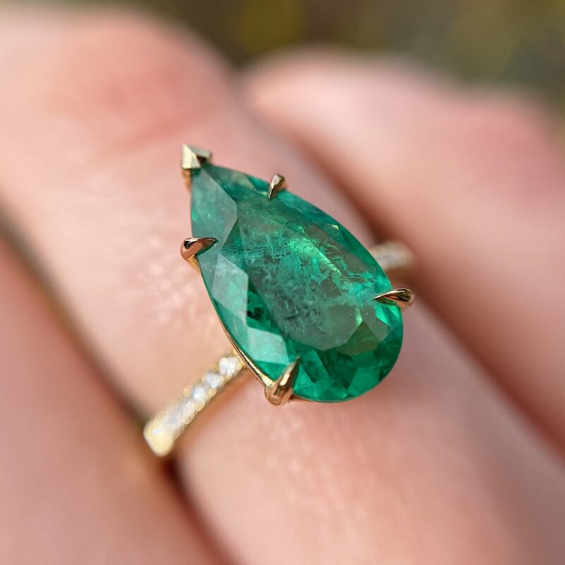 Pear shape emerald solitaire ring