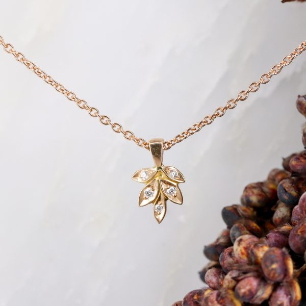 18ct rose gold rose and thorn pendant