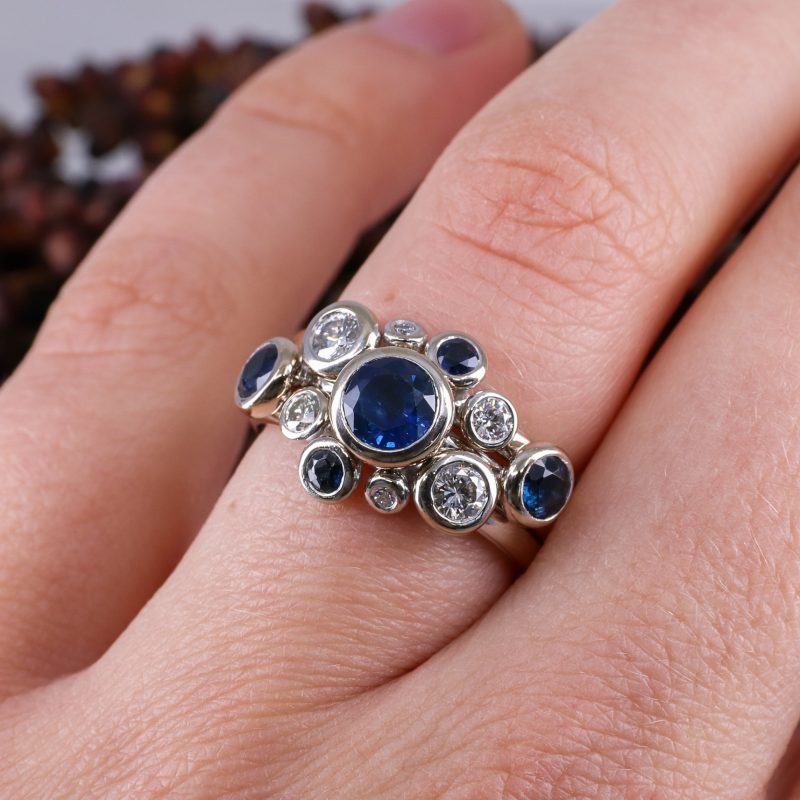 18ct white gold three part concentric ring with blue sapphires and white diamonds