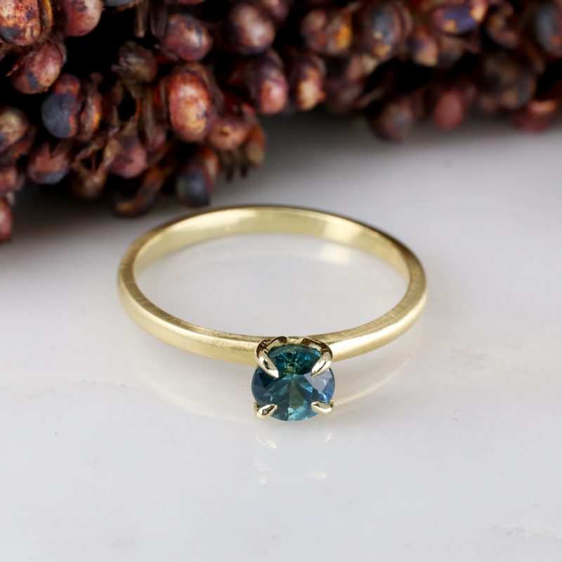 18ct yellow gold tulip ring with 0.66ct teal sapphire