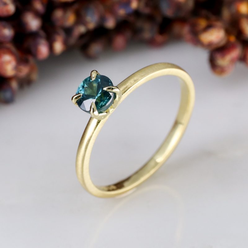 18ct yellow gold tulip ring with 0.66ct teal sapphire