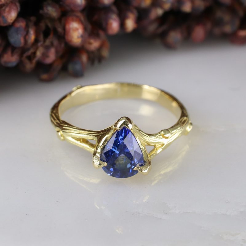 18ct yellow gold woodland ring with pear-shaped blue sapphire