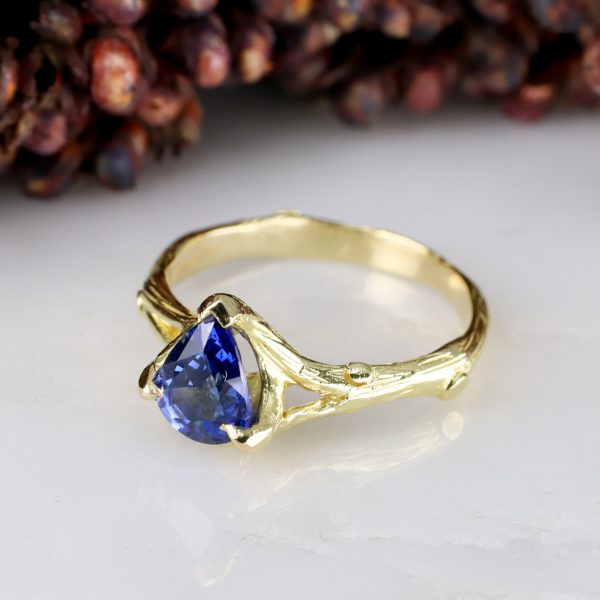 18ct yellow gold woodland ring with pear-shaped blue sapphire