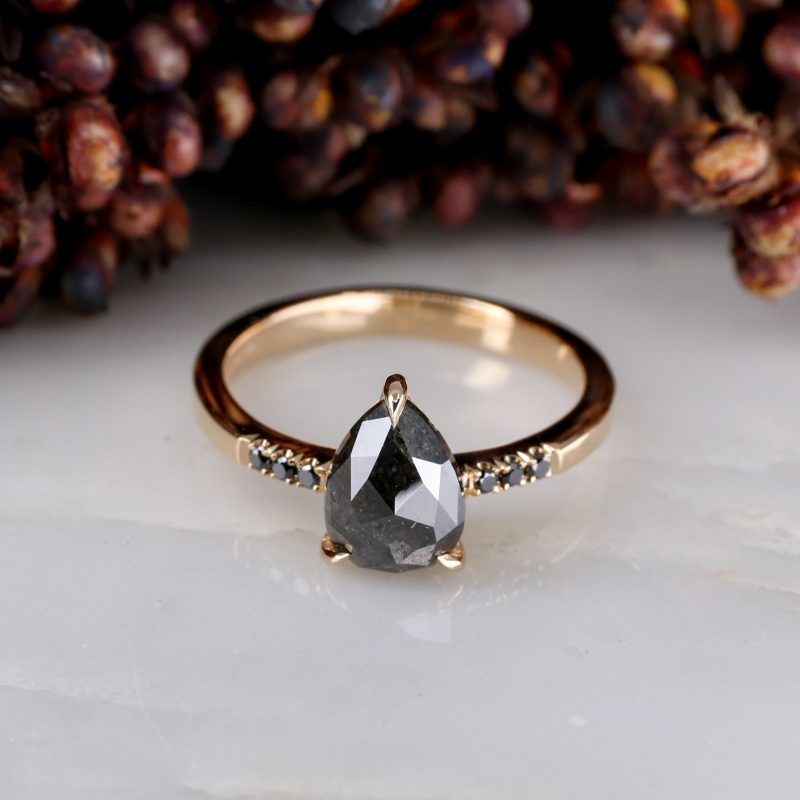 18ct rose gold pear shape salt and pepper diamond with black diamond shoulders