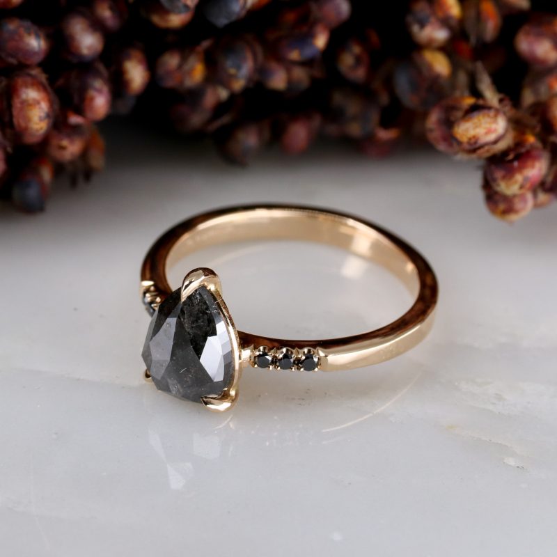 18ct rose gold pear shape salt and pepper diamond with black diamond shoulders