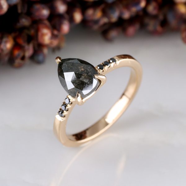 18ct rose gold pear shape salt and pepper diamond with black diamond shoulders