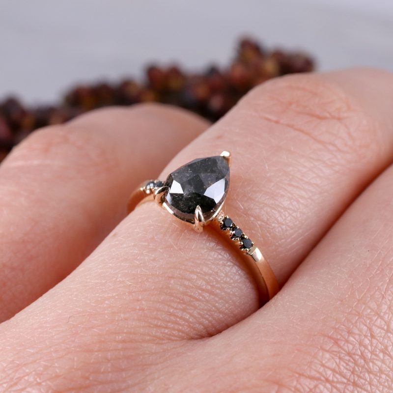 18ct rose gold pear shape salt and pepper diamond with black diamond shoulders