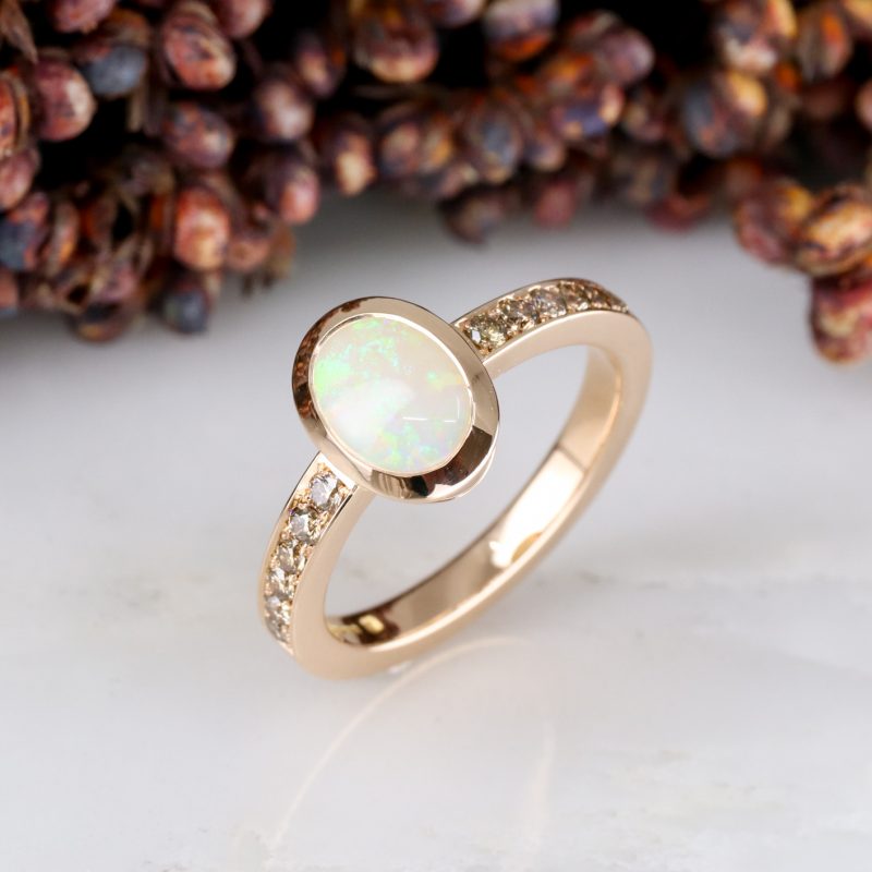 18ct rose gold opal ring with cinnamon diamond shoulders