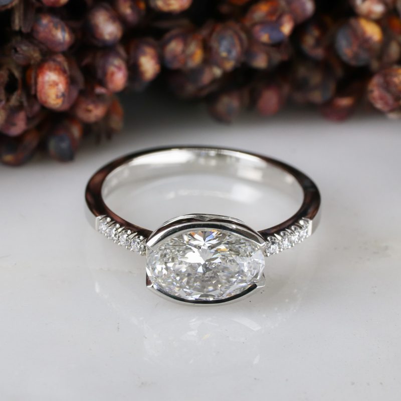 Platinum east-west set lab grown white diamond rise ring with white diamond shoulders