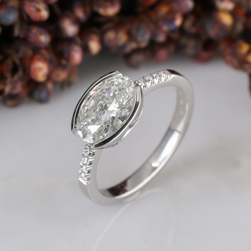 Platinum east-west set lab grown white diamond rise ring with white diamond shoulders