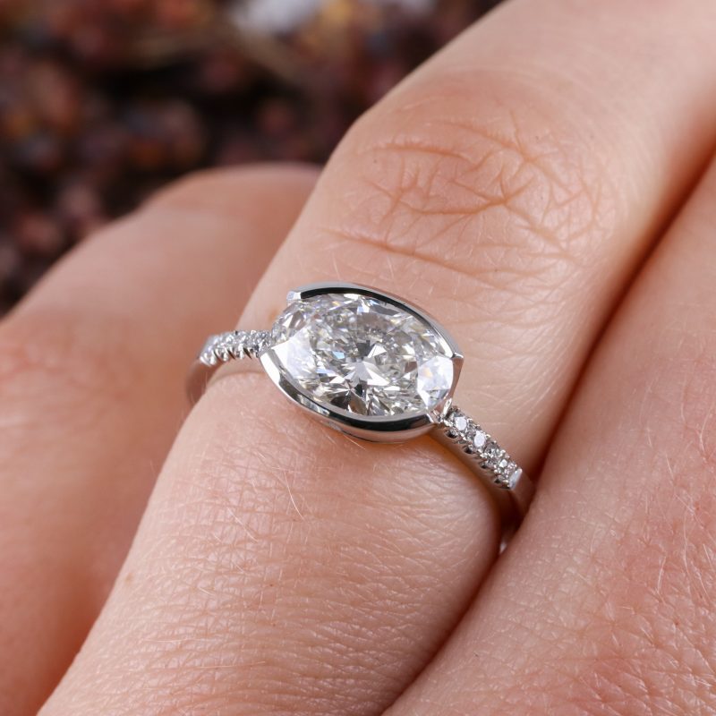 Platinum east-west set lab grown white diamond rise ring with white diamond shoulders