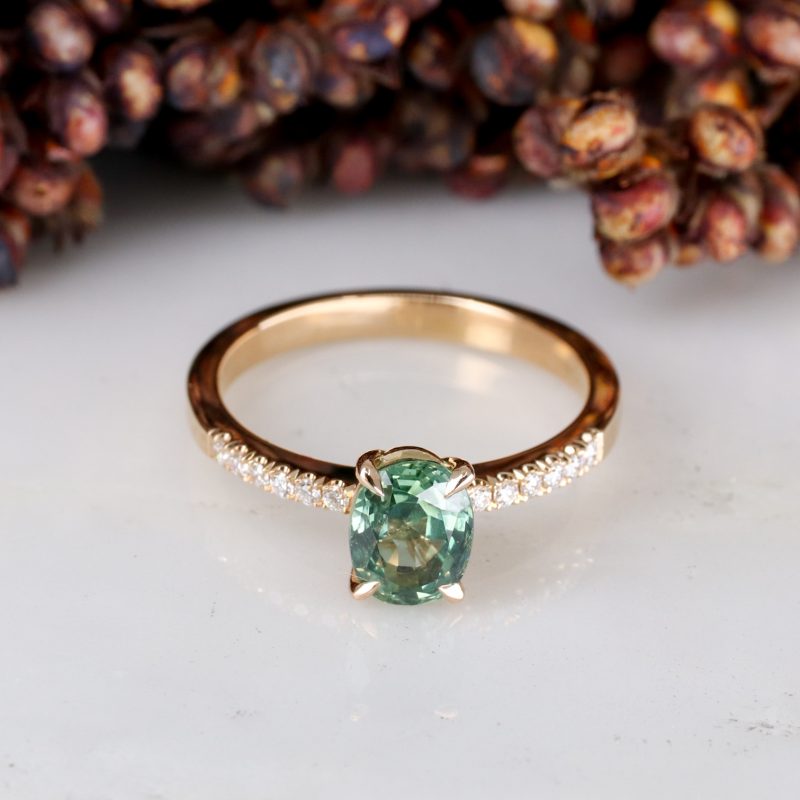 18ct rose gold seafoam coloured sapphire rise ring with white diamond shoulders