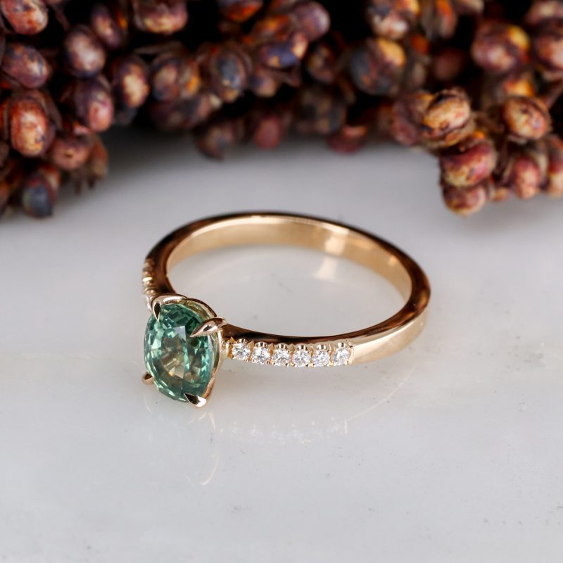 18ct rose gold seafoam coloured sapphire rise ring with white diamond shoulders