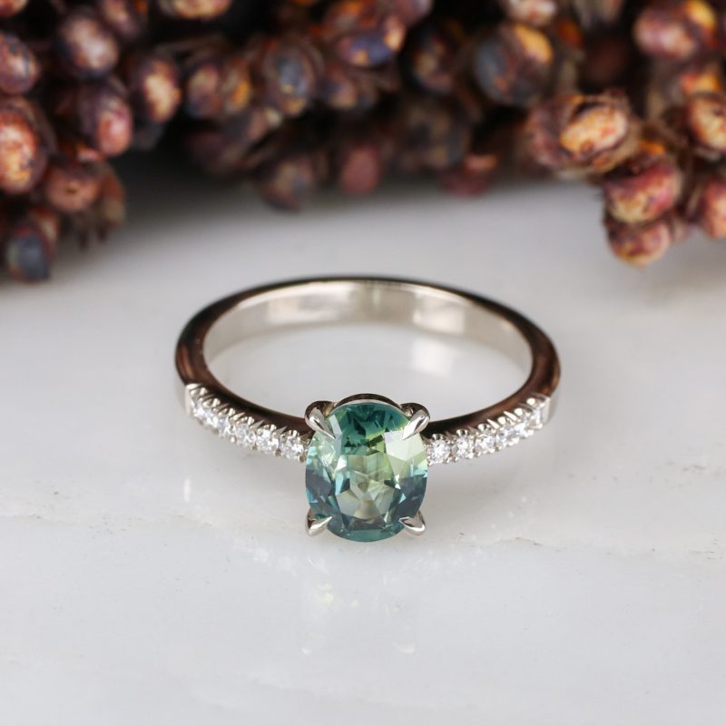 18ct white gold green sapphire rise ring with white diamond shoulders