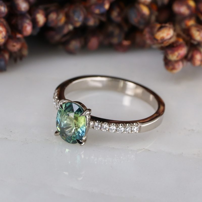 18ct white gold green sapphire rise ring with white diamond shoulders