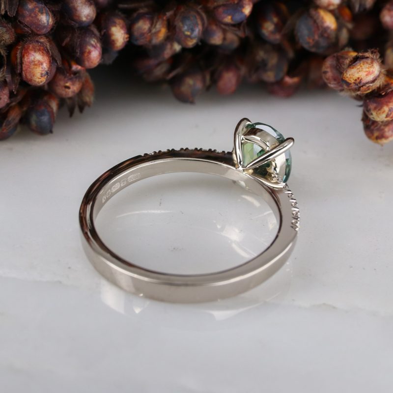 18ct white gold green sapphire rise ring with white diamond shoulders