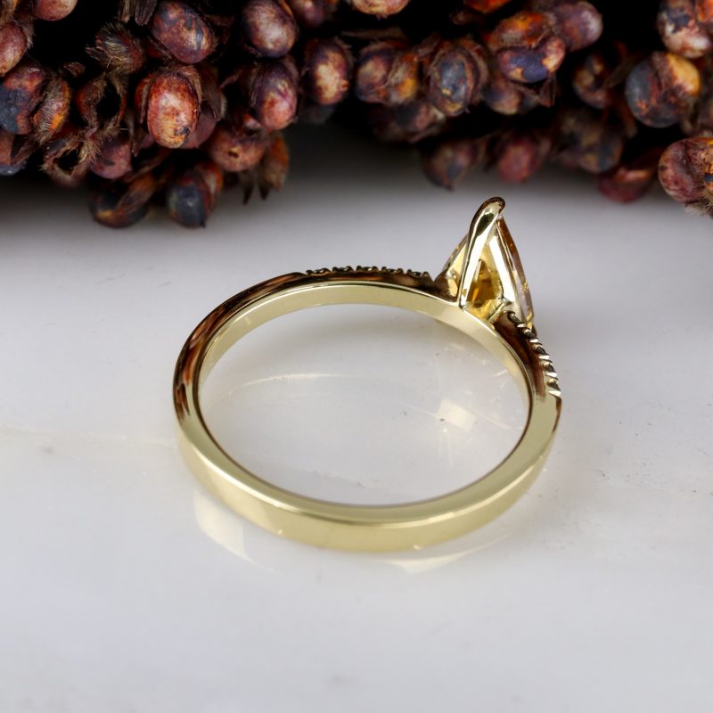 18ct yellow gold orange diamond rise ring with black diamond shoulders