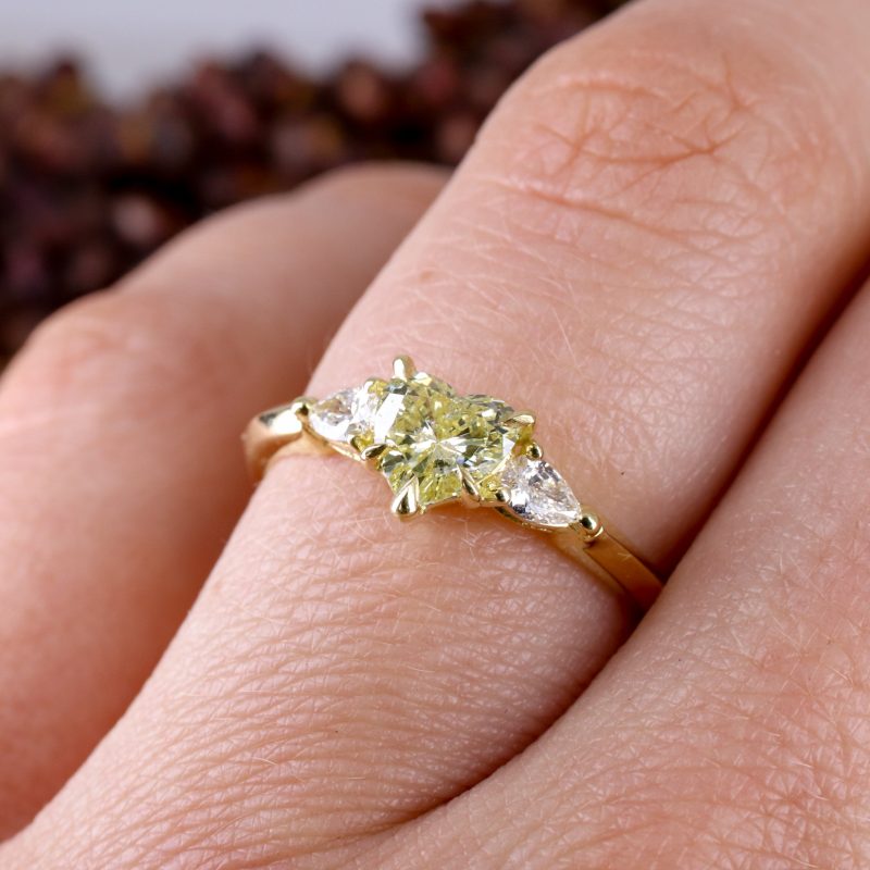 18ct yellow gold heart shape pale yellow diamond trilogy ring with white diamond pear shape shoulders