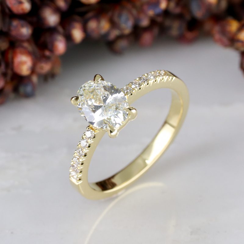 18ct yellow gold oval lab grown diamond rise ring with diamond shoulders