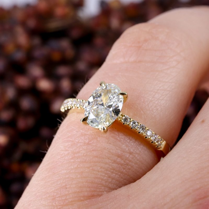 18ct yellow gold oval lab grown diamond rise ring with diamond shoulders