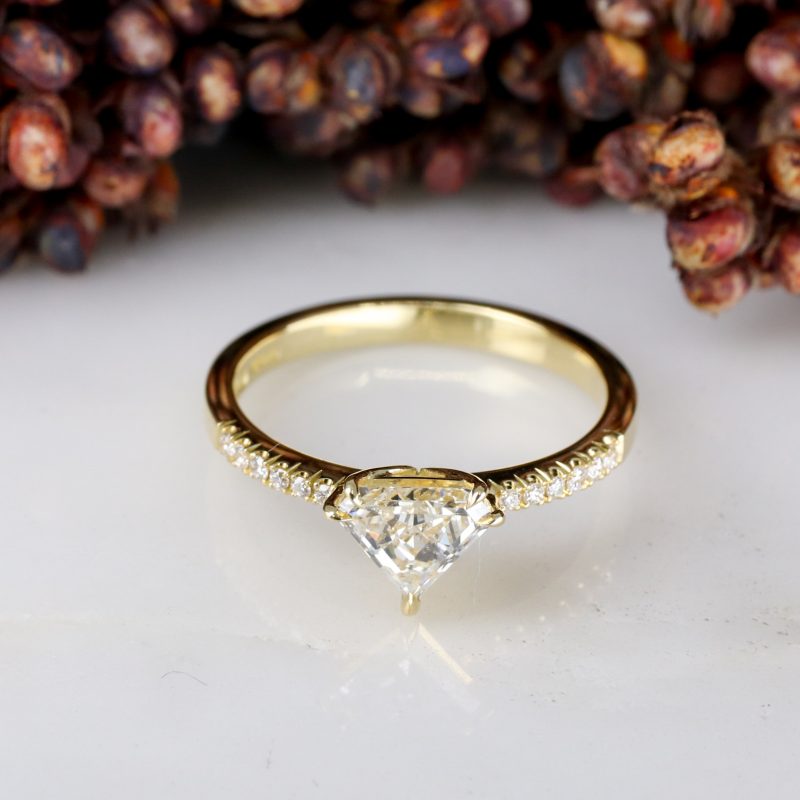 18ct yellow gold shield shape diamond rise ring with diamond shoulders