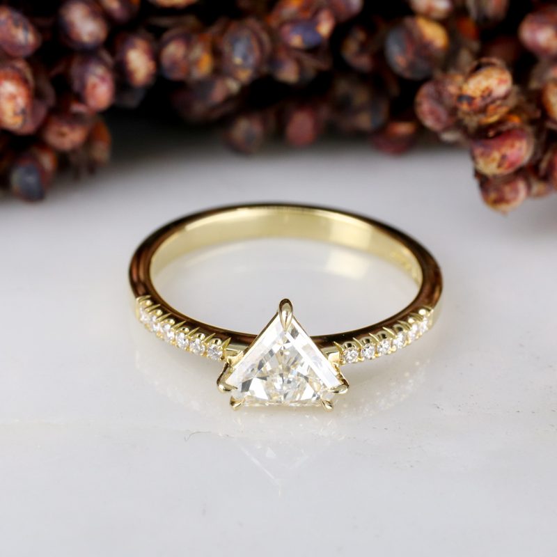 18ct yellow gold shield shape diamond rise ring with diamond shoulders