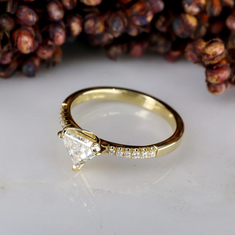 18ct yellow gold shield shape diamond rise ring with diamond shoulders