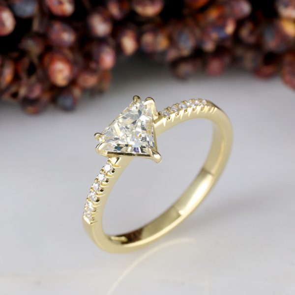 18ct yellow gold shield shape diamond rise ring with diamond shoulders