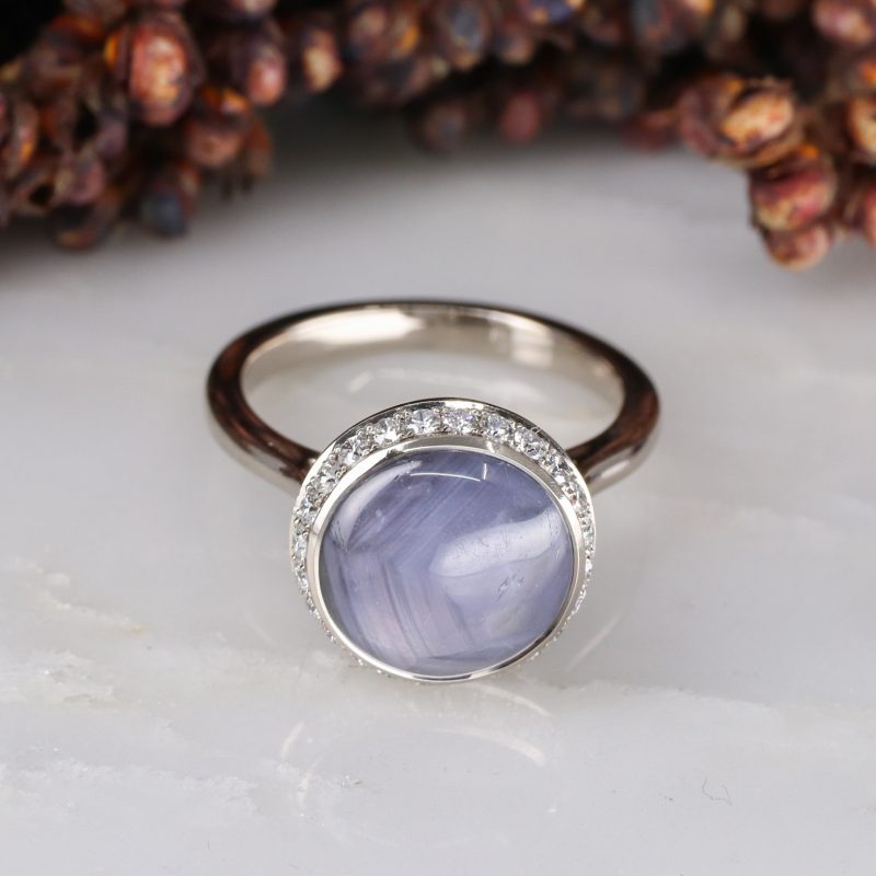 18ct white gold star sapphire ring with white diamond halo