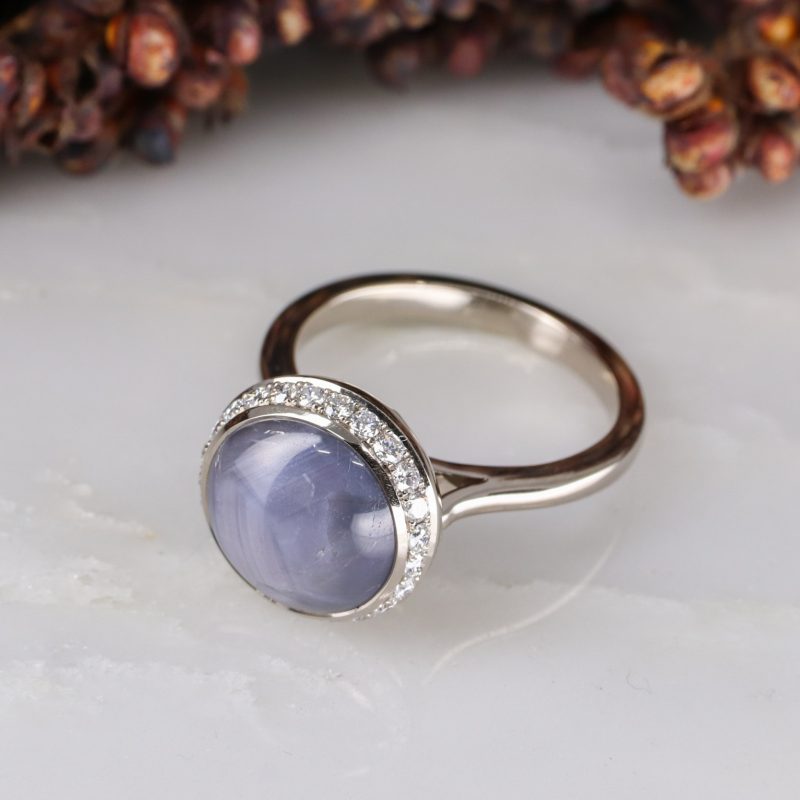 18ct white gold star sapphire ring with white diamond halo
