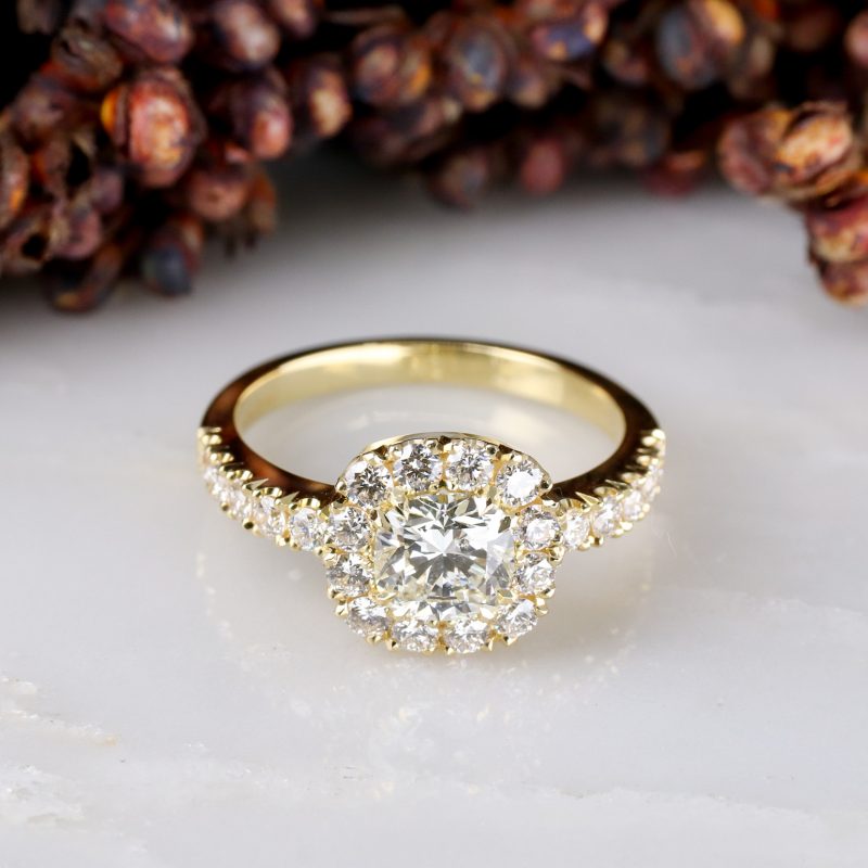 18ct yellow gold cushion cut white diamond ring with diamond halo and shoulder detail