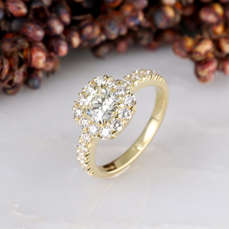 18ct yellow gold cushion cut white diamond ring with diamond halo and shoulder detail