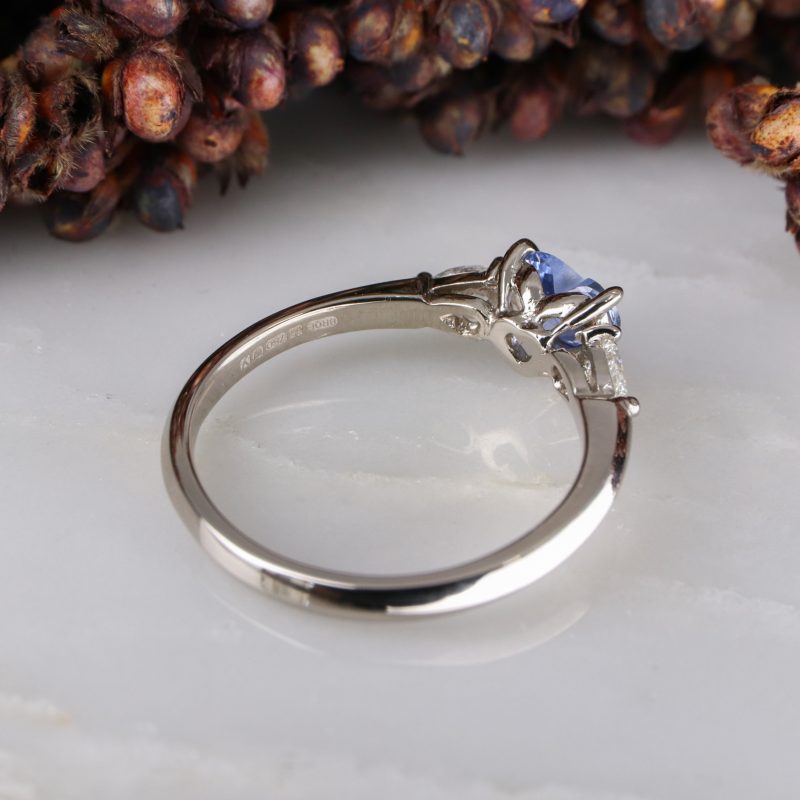 18ct white gold heart shape blue sapphire trilogy ring with white diamond pear shape shoulders