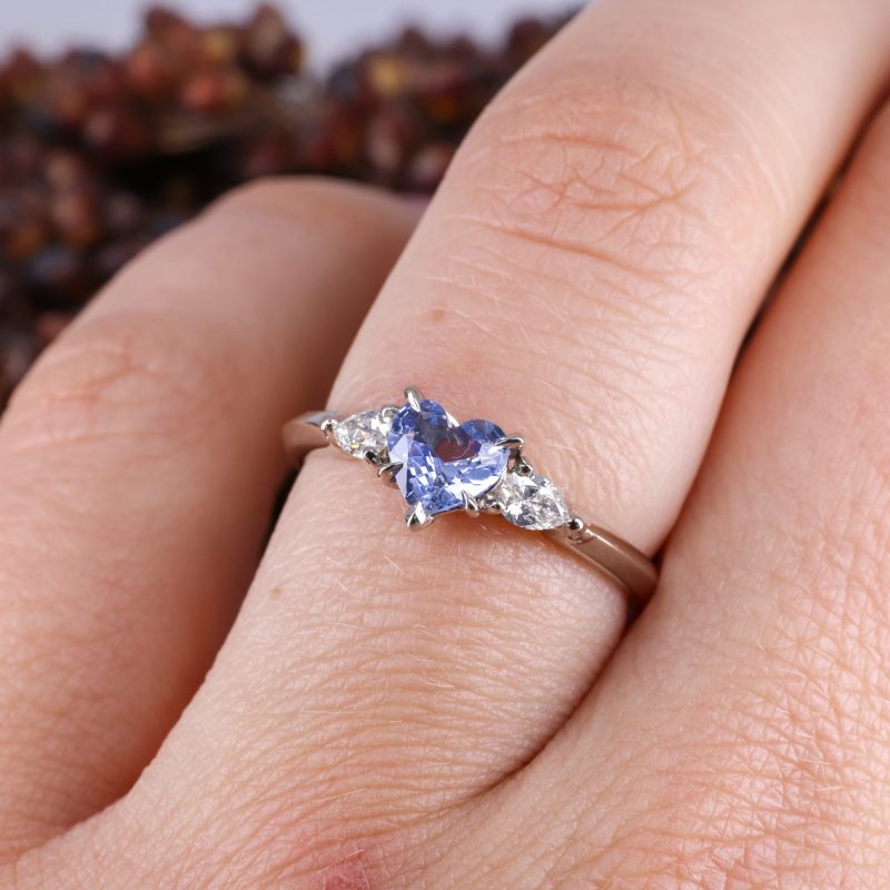 18ct white gold heart shape blue sapphire trilogy ring with white diamond pear shape shoulders