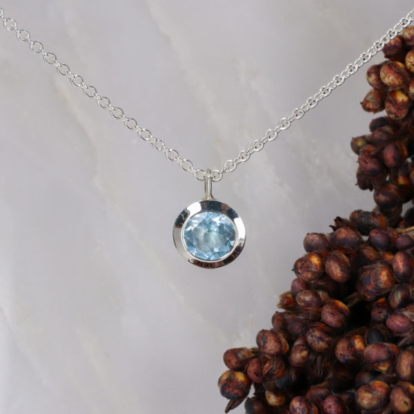Silver and sky blue topaz pendant
