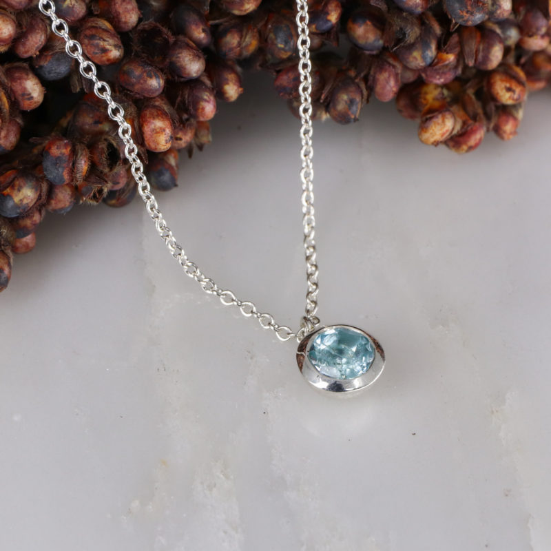 Small silver and sky blue topaz pendant
