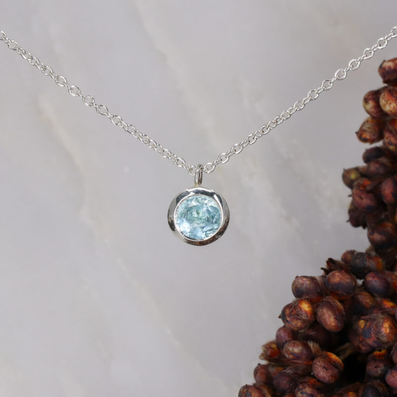Small silver and sky blue topaz pendant
