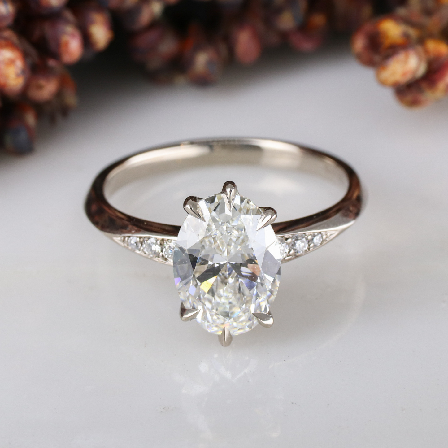 Platinum Coco engagement ring with lab-grown diamond oval centre ...