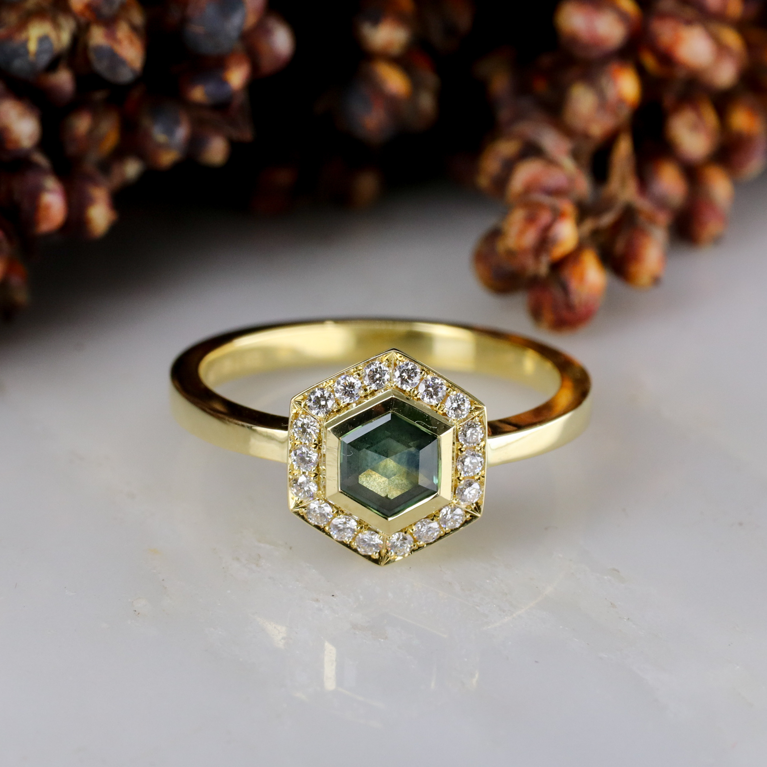 18ct yellow gold Hexagon halo ring with Montana Sapphire and White