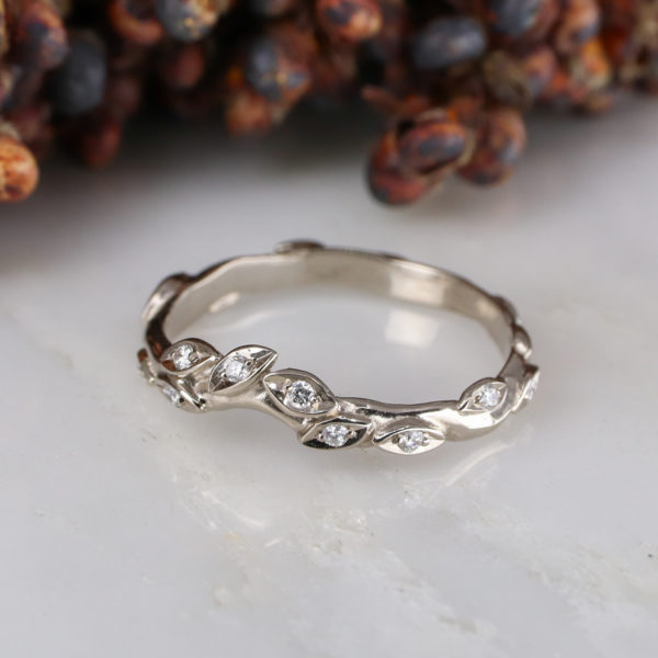 18ct white gold and white diamond curved rose and thorn wedding band