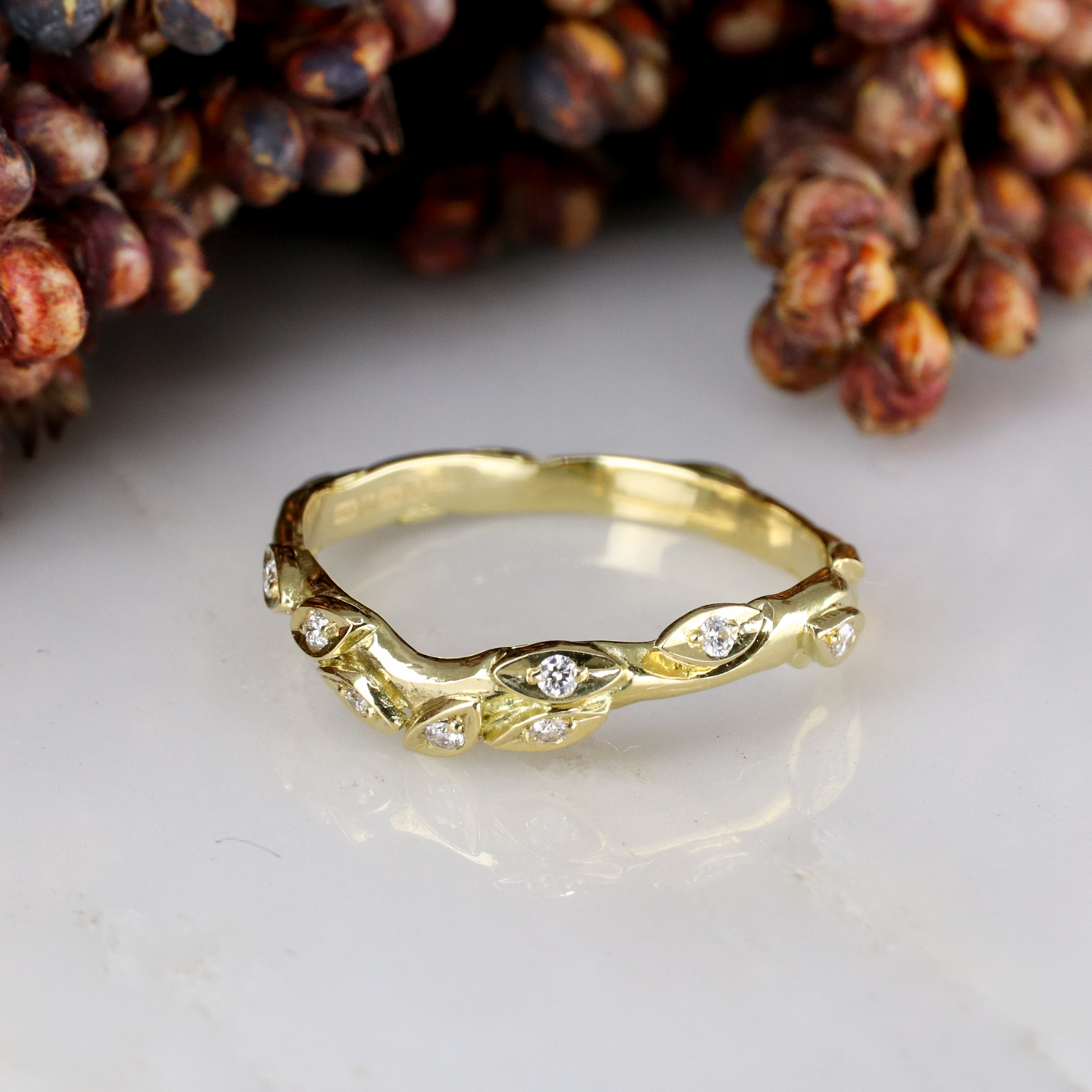 18ct yellow gold and white diamond curved rose and thorn wedding band