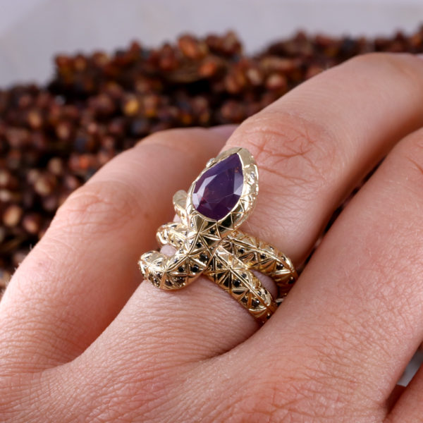 9ct yellow gold Wood Snake ring with pear shaped purple sapphire and black diamonds